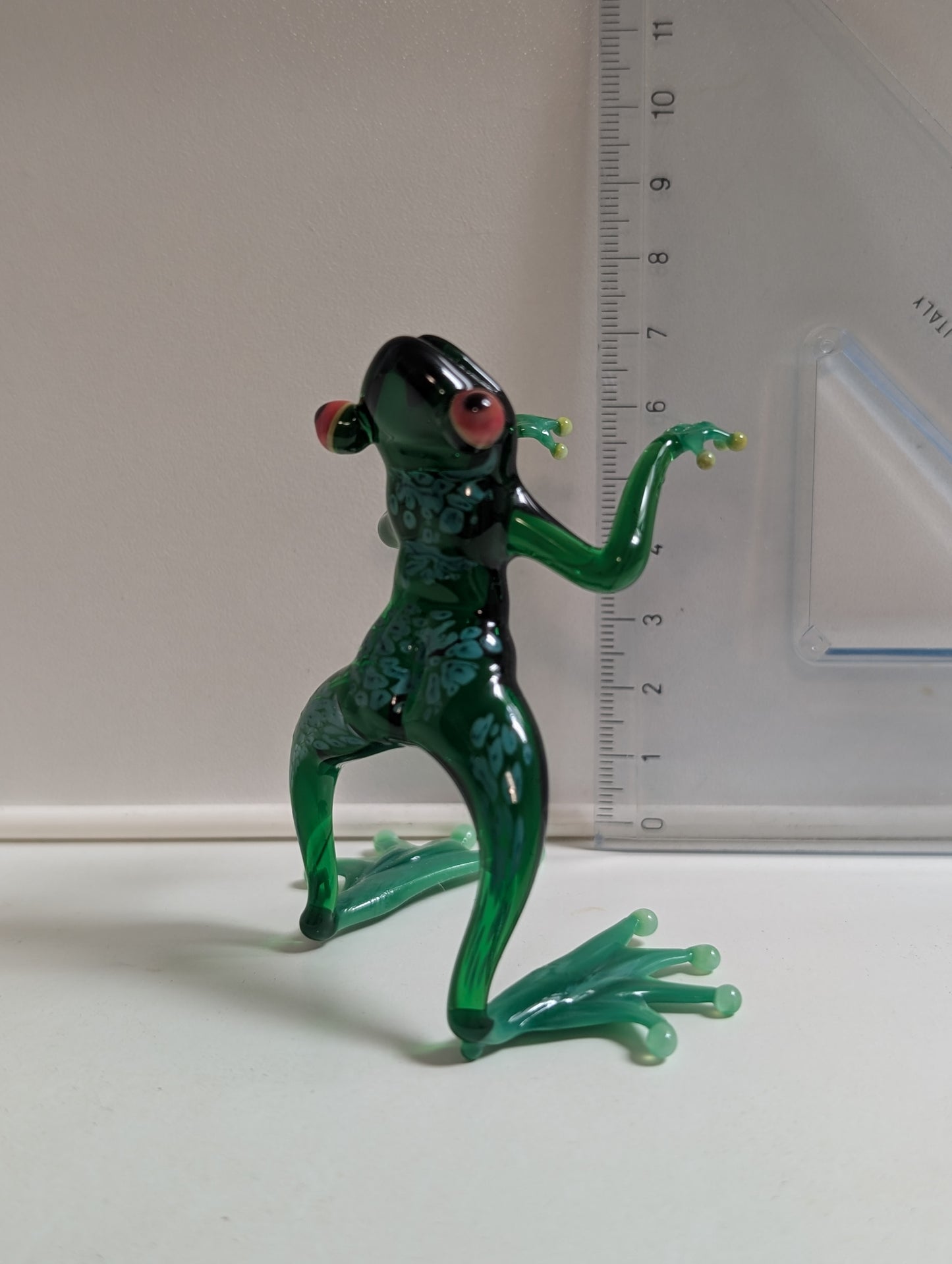 Green frog-meteorologist.