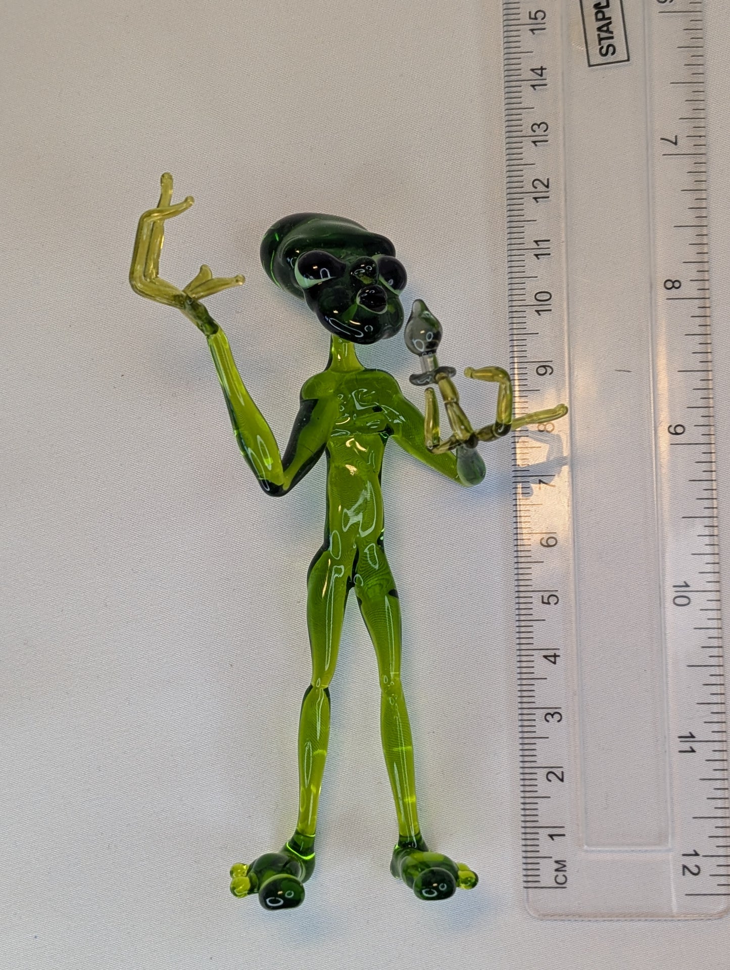 An alien with a happiness device.