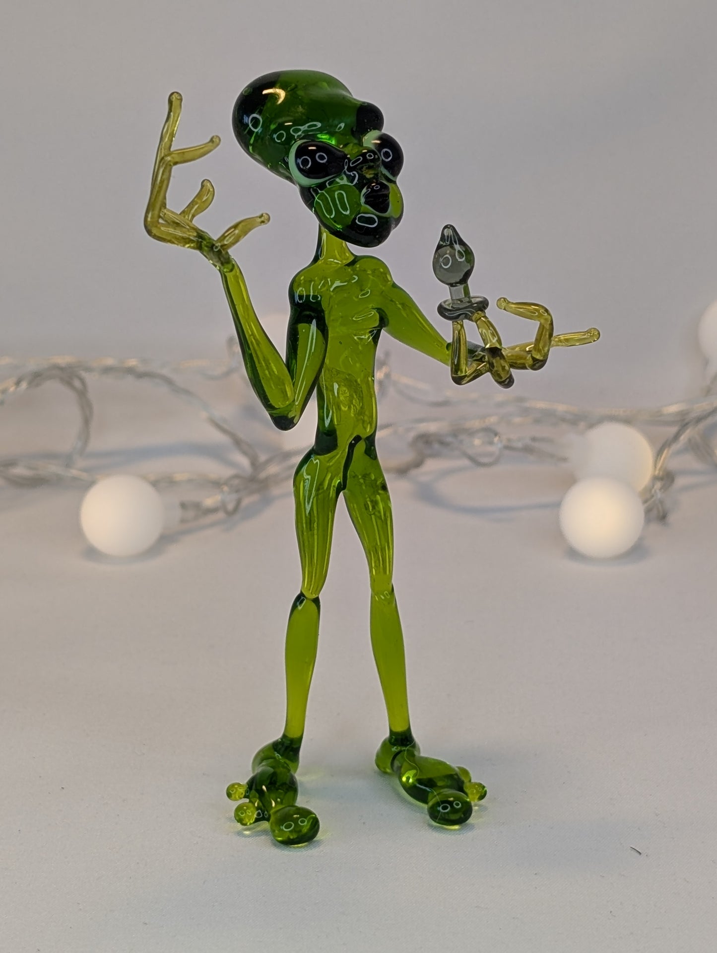 An alien with a happiness device.