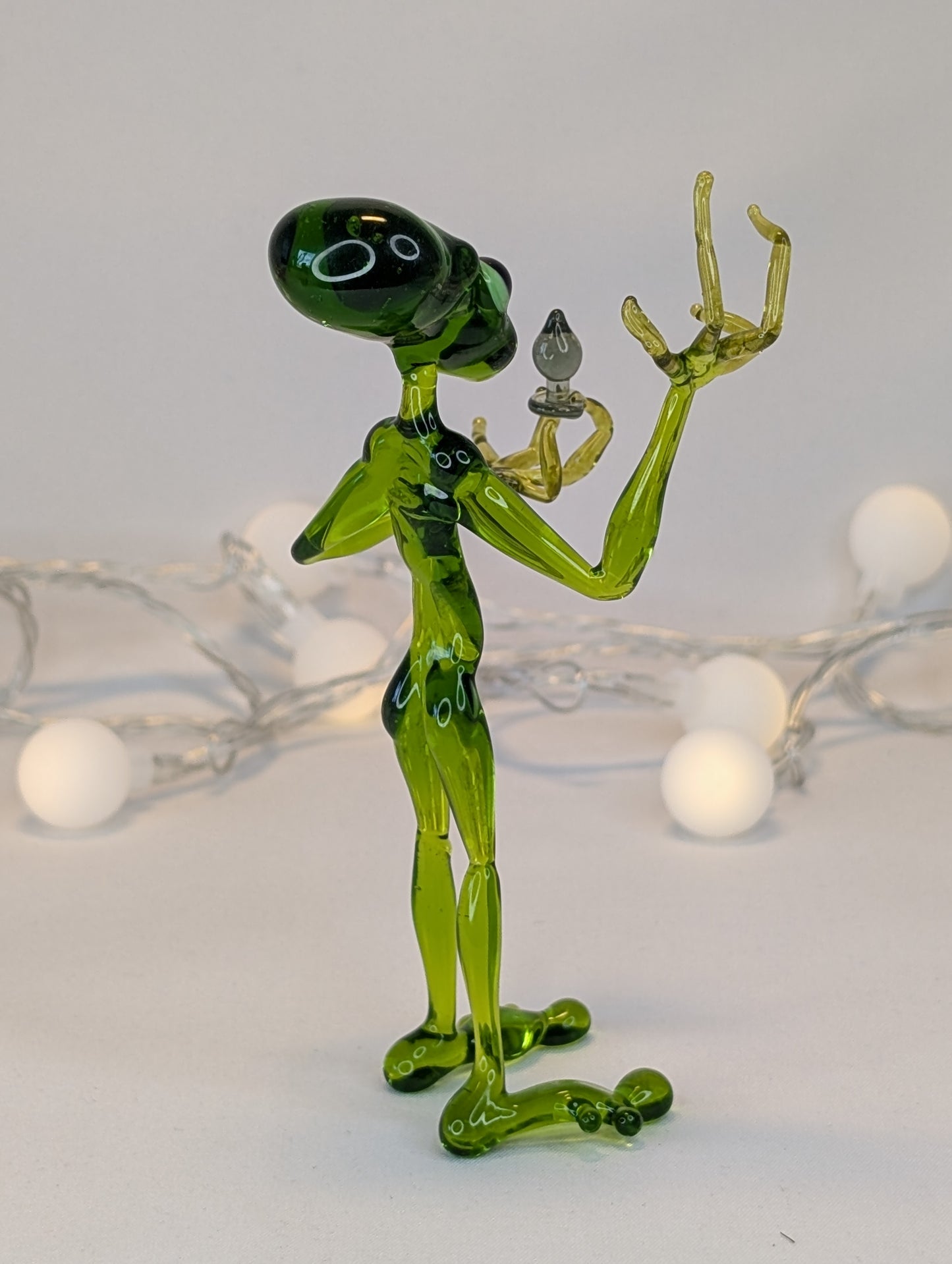 An alien with a happiness device.