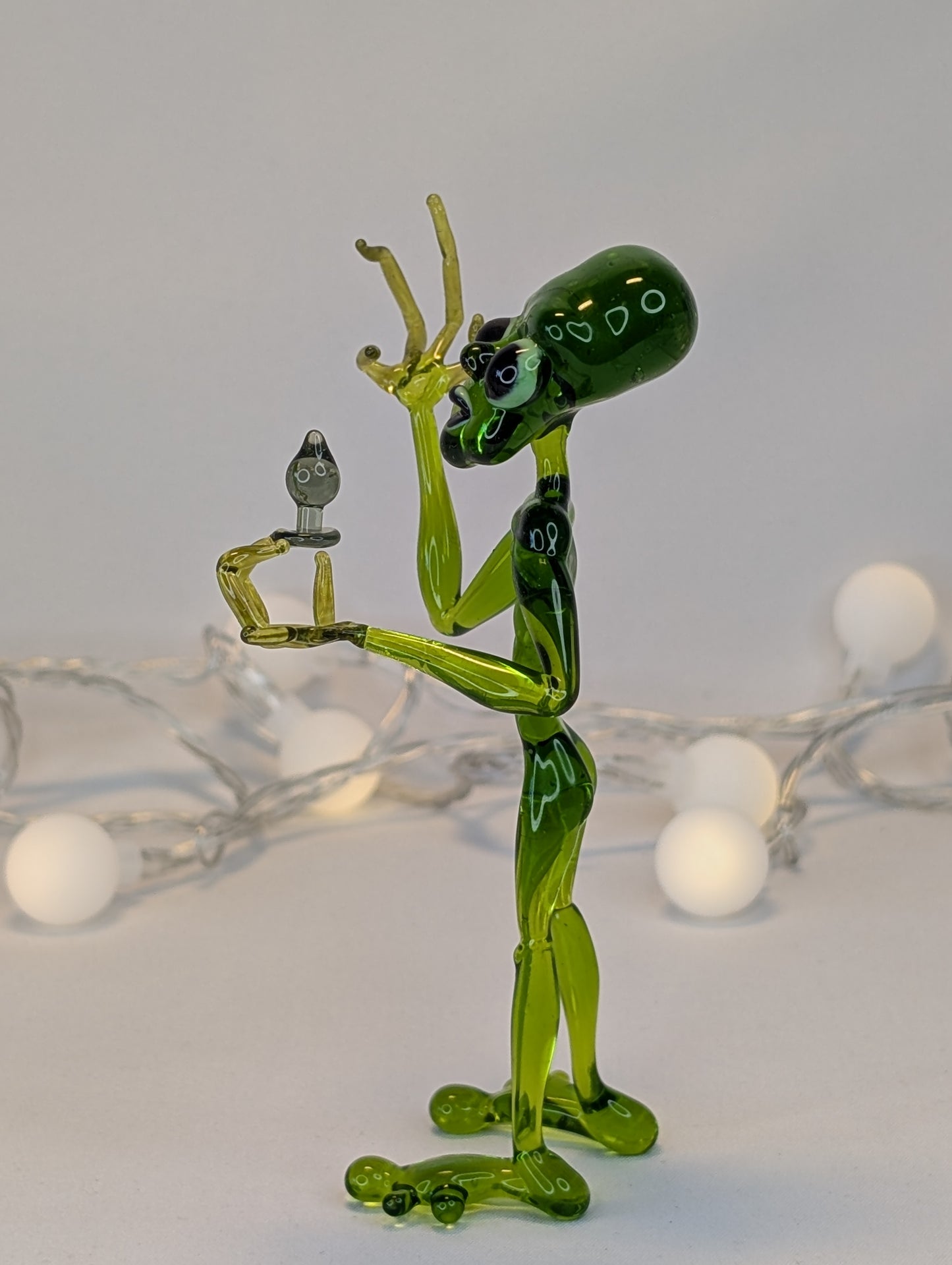 An alien with a happiness device.